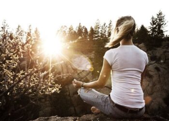 fbaaec woman meditating on mountain