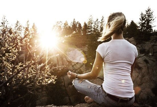 fbaaec woman meditating on mountain